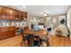 Open floor plan showcasing the kitchen, dining area, and cozy fireplace in the living room at 13744 W 86Th Dr, Arvada, CO 80005