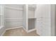 Spacious walk-in closet with built-in shelving and ample hanging space, provides efficient storage solutions at 13744 W 86Th Dr, Arvada, CO 80005