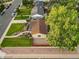 Aerial view of a home with colorful landscaping and a well-manicured lawn at 488 S Leyden St, Denver, CO 80224