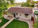 Aerial view of backyard showcasing green lawn, red rock landscaping, and wood perimeter fence at 488 S Leyden St, Denver, CO 80224