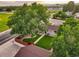 Aerial view of backyard featuring green lawn, professional landscaping, privacy fence, and mature trees at 488 S Leyden St, Denver, CO 80224