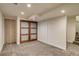 Finished basement features plush carpeting, recessed lighting, and stylish wood doors for a cozy and inviting space at 488 S Leyden St, Denver, CO 80224