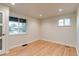 Bright bedroom features hardwood floors, recessed lighting, and two windows at 488 S Leyden St, Denver, CO 80224