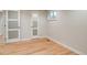 Cozy bedroom with glass accent doors and a window, offering natural light and an inviting atmosphere at 488 S Leyden St, Denver, CO 80224