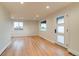 Bright living room with hardwood floors, recessed lighting, and a modern door at 488 S Leyden St, Denver, CO 80224