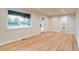 Bright living room featuring hardwood floors, recessed lighting, and a modern door at 488 S Leyden St, Denver, CO 80224
