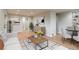 Comfortable living room with contemporary decor, a plush sofa, and hardwood floors for a welcoming ambiance at 488 S Leyden St, Denver, CO 80224