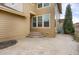 Backyard with stamped concrete patio and stairs at 21719 E Tallkid Ave, Parker, CO 80138