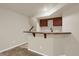 Basement wet bar with sink and storage cabinets at 21719 E Tallkid Ave, Parker, CO 80138