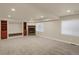 Spacious basement Gathering room with fireplace and built-in shelving at 21719 E Tallkid Ave, Parker, CO 80138