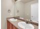 Bathroom with double vanity and a large mirror at 21719 E Tallkid Ave, Parker, CO 80138