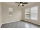 Well-lit bedroom with tile floors and window blinds at 21719 E Tallkid Ave, Parker, CO 80138