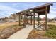 Community park with covered benches and walkway at 21719 E Tallkid Ave, Parker, CO 80138