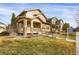 Two-story house on a tree-lined street with a large front yard at 21719 E Tallkid Ave, Parker, CO 80138