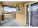 Covered front porch with wooden flooring and a view of the neighborhood at 21719 E Tallkid Ave, Parker, CO 80138