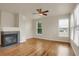 Bright living room featuring hardwood floors and a fireplace at 21719 E Tallkid Ave, Parker, CO 80138