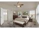 Large main bedroom with plush carpet, high ceiling and large windows at 21719 E Tallkid Ave, Parker, CO 80138