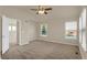 Spacious main bedroom with plush carpet and ceiling fan at 21719 E Tallkid Ave, Parker, CO 80138