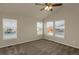 Main bedroom with carpeted floors and multiple windows at 21719 E Tallkid Ave, Parker, CO 80138