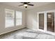 Home office with tile floors, ceiling fan, and double French doors at 21719 E Tallkid Ave, Parker, CO 80138