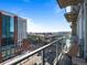 Cozy balcony with a chair overlooking the city and nearby buildings on a clear day at 891 14Th St # 1211, Denver, CO 80202