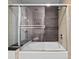 Modern bathroom featuring a shower over tub and contemporary tile surround at 891 14Th St # 1211, Denver, CO 80202