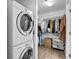 Laundry room with washer and dryer, and custom shelving at 891 14Th St # 1211, Denver, CO 80202