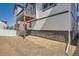 Backyard featuring an elevated deck and attractive stone detailing along the home's exterior at 2128 S Haleyville Way, Aurora, CO 80018