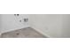 A simple laundry room with tile floors and utility connections at 2128 S Haleyville Way, Aurora, CO 80018
