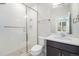 Modern bathroom with tiled shower, glass door, and vanity with sink at 2321 Lakeshore Ln # 10, Superior, CO 80027