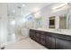 Luxurious bathroom with a glass-enclosed shower, soaking tub, dual vanity, and designer fixtures at 2321 Lakeshore Ln # 10, Superior, CO 80027