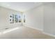 Spacious bedroom featuring neutral carpet, recessed lighting, and large windows for ample natural light and bright neutral paint at 2321 Lakeshore Ln # 10, Superior, CO 80027