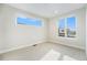 Sunlit bedroom with large windows offering clear sky views and bright neutral paint and carpet at 2321 Lakeshore Ln # 10, Superior, CO 80027