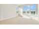 Bright bedroom with large windows overlooking lake and community views, neutral paint, and carpet at 2321 Lakeshore Ln # 10, Superior, CO 80027
