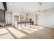 Open kitchen and dining area with large island and modern light fixtures at 2321 Lakeshore Ln # 10, Superior, CO 80027