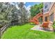 Green backyard featuring a patio with seating and large grassy space at 10822 Eagle Crest Ct, Parker, CO 80138