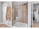 Modern bathroom featuring a glass shower with a large shower head and decorative tile and a view of the soaking tub at 10822 Eagle Crest Ct, Parker, CO 80138