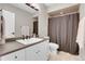 Neutral bathroom features a vanity, modern fixtures, stylish tile and a shower with curtain at 10822 Eagle Crest Ct, Parker, CO 80138