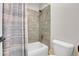 Bathroom with green tile in shower and neutral color scheme at 10822 Eagle Crest Ct, Parker, CO 80138