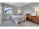 Bedroom with neutral walls, carpet, window, and dresser at 10822 Eagle Crest Ct, Parker, CO 80138
