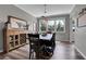 Rustic dining room with a modern chandelier and plenty of natural light at 10822 Eagle Crest Ct, Parker, CO 80138