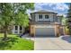 Charming two-story home featuring gray painted and brick accents, landscaped lawn and a spacious two-car garage at 10822 Eagle Crest Ct, Parker, CO 80138