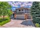 Stunning home with brick accents, a three-car garage, and well-manicured lawn at 10822 Eagle Crest Ct, Parker, CO 80138