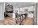 Bright kitchen with white cabinets, stainless steel appliances, and a center island with rustic wood accents at 10822 Eagle Crest Ct, Parker, CO 80138