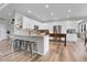 Large kitchen with white cabinets, stainless steel appliances, granite counters, and a big center island with bar seating at 10822 Eagle Crest Ct, Parker, CO 80138