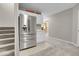 Kitchen area with stainless steel refrigerator and an opening to a nearby room at 10822 Eagle Crest Ct, Parker, CO 80138