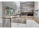 Farmhouse style kitchen sink with stainless steel appliances and stunning granite countertops at 10822 Eagle Crest Ct, Parker, CO 80138