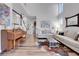 Bright living room with an open floor plan and a piano at 10822 Eagle Crest Ct, Parker, CO 80138