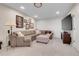 Living room with a comfortable sectional sofa, carpeting, and a mounted TV at 10822 Eagle Crest Ct, Parker, CO 80138