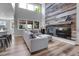 Beautiful living room showcasing the vaulted ceiling, fireplace with wood accents, and bright natural light at 10822 Eagle Crest Ct, Parker, CO 80138